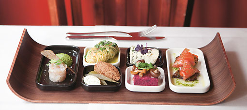 A tray with different small dishes.