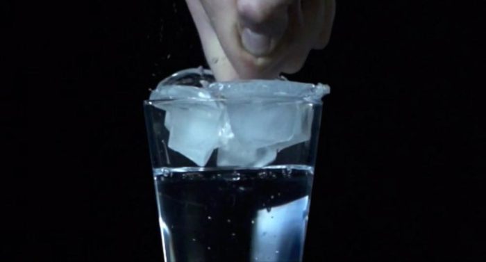 This new kind of ice cube sits over the mouth of the glass, then breaks into small ice cubes when struck.