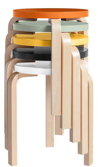 Stacked three-legged stools in different colours.