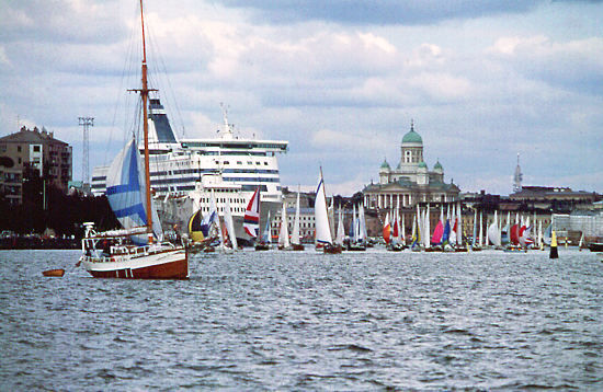 Helsinki seen from the sea; sailboats in the water and Helsinki Cathedral in the background.