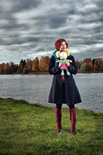 Niina Tuikkala holds a doll version of Hertta, who began in a cartoon show and now appears in online and mobile learning games.