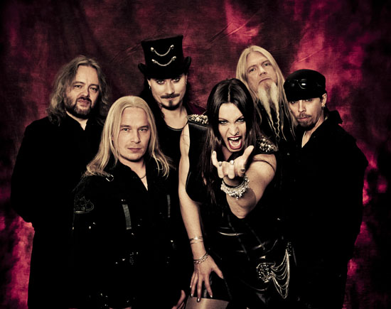 The members of Nightwish posing in black clothes against a burgundy velvet background.