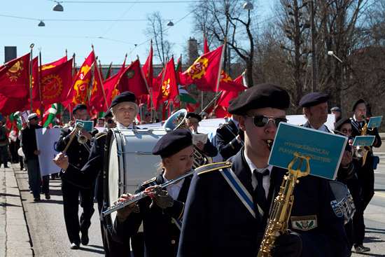 A parade headed by an orchestra.