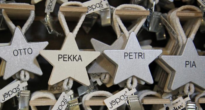 Star-shaped towel holders with Finnish names on them.