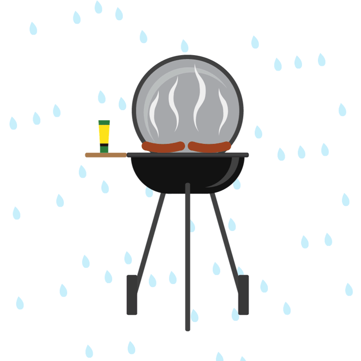 A black kettle barbecue grill is standing in the rain with two steaming sausages cooking on it.