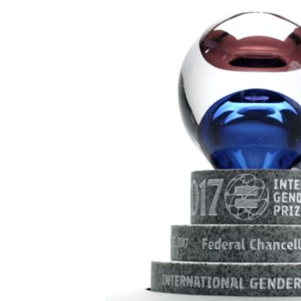 The International Gender Equality Prize trophy; a red and blue glass sphere on a granite base.