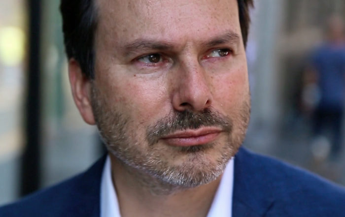 A close-up of a serious-looking Simon Anholt.