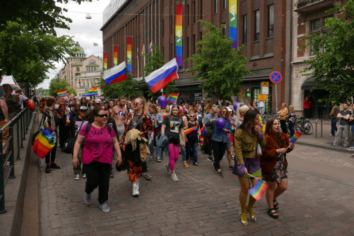 A large crowd walking past Stockmann department store.