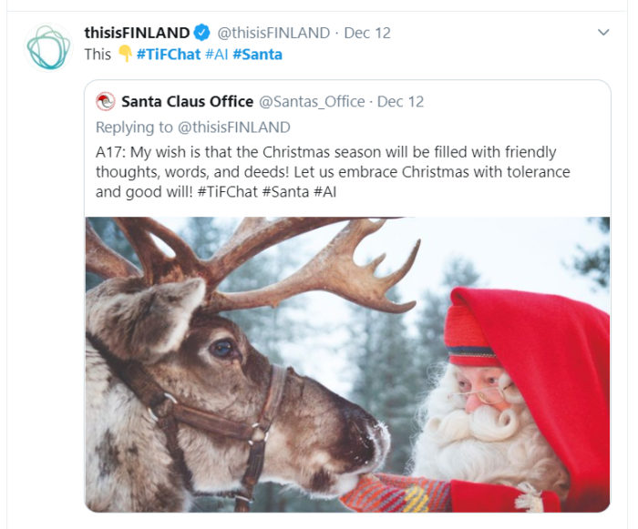 In a screenshot from Twitter, Santa Claus pets the muzzle of one of his reindeer.