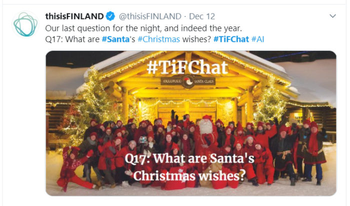 A screenshot from Twitter shows Santa with a group of elves in front of a house.