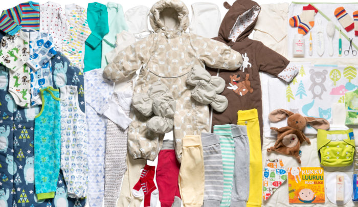 Contents of the Finnish maternity package, for example baby clothes and toys.,