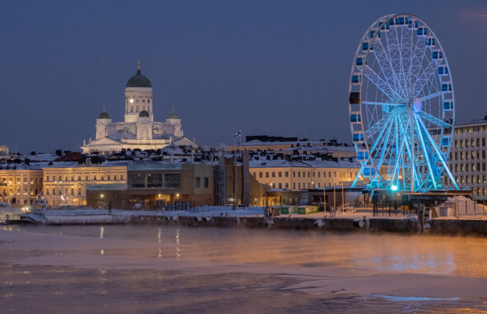 Downtown Helsinki is seen from across an expanse of water.