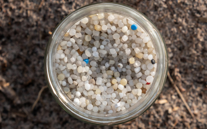A jar filled with plastic pellets.
