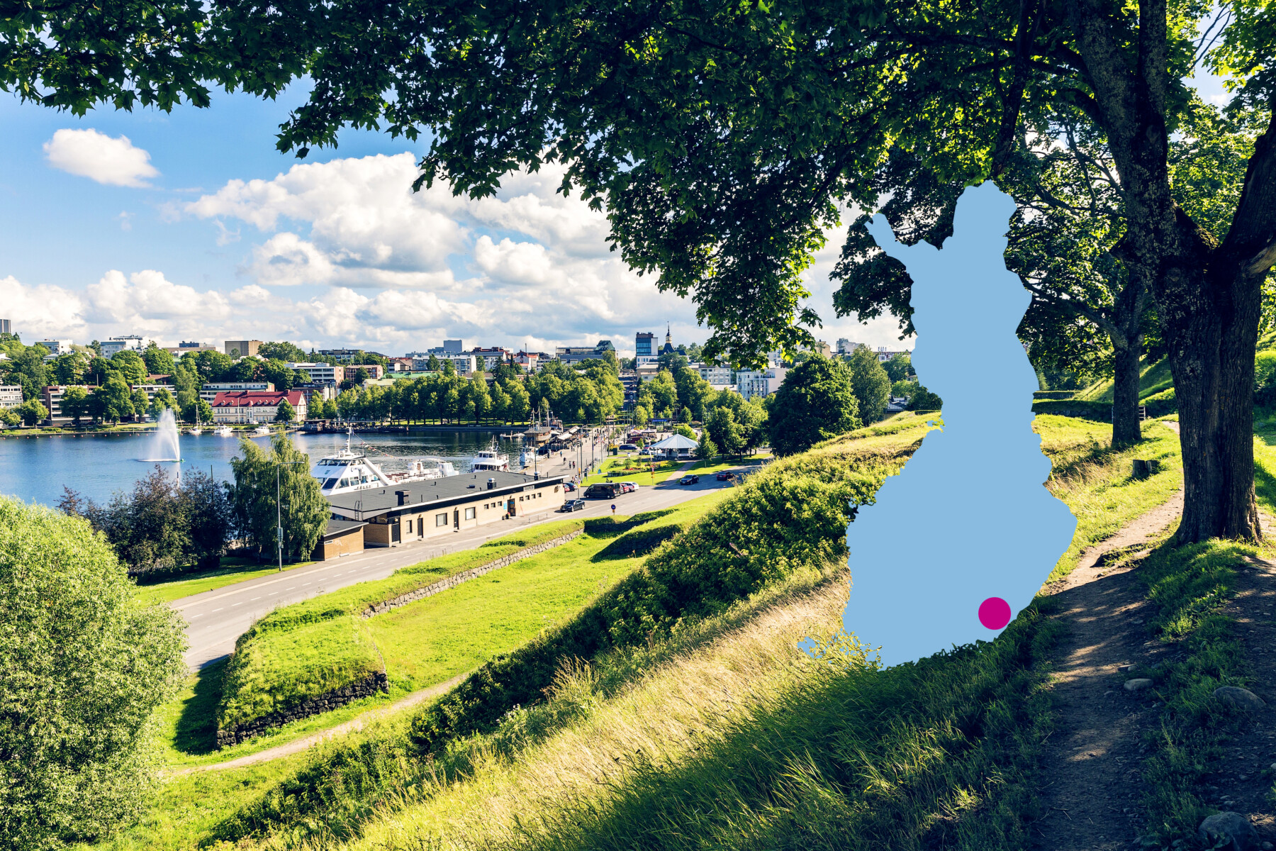 Buildings and a harbour are shown in a view from a green hill in a park in Lappeenranta, a city in southeastern Finland on the shore of Lake Saimaa.
