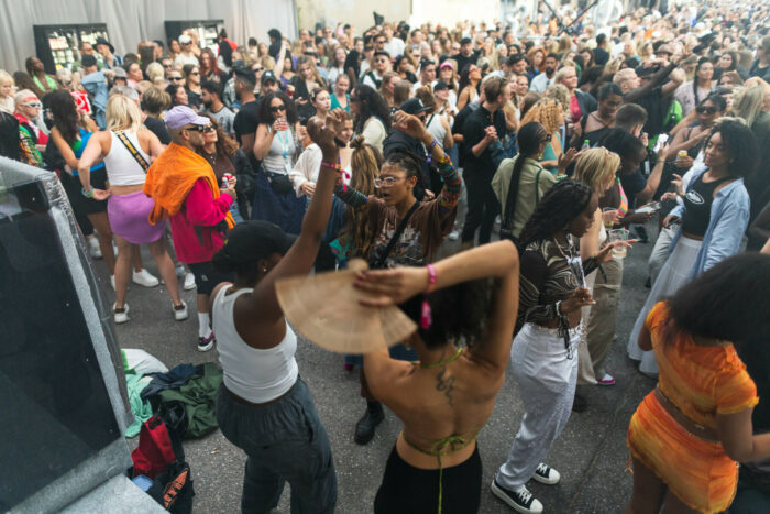 Crowds of people are dancing.