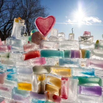 Blocks of ice of various colours form an attractive wall in the sunlight on Lauttasaari, an island in Helsinki.